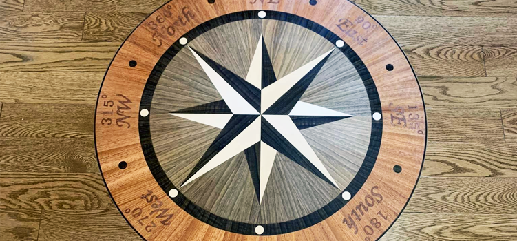 floor renovation with a custom wood work of a compass design created in Maryland