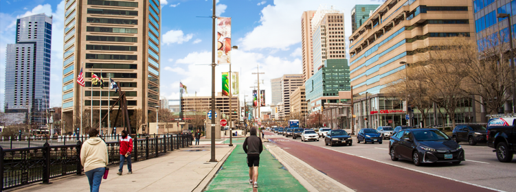 Downtown Harbor Baltimore City scene of the street view with people